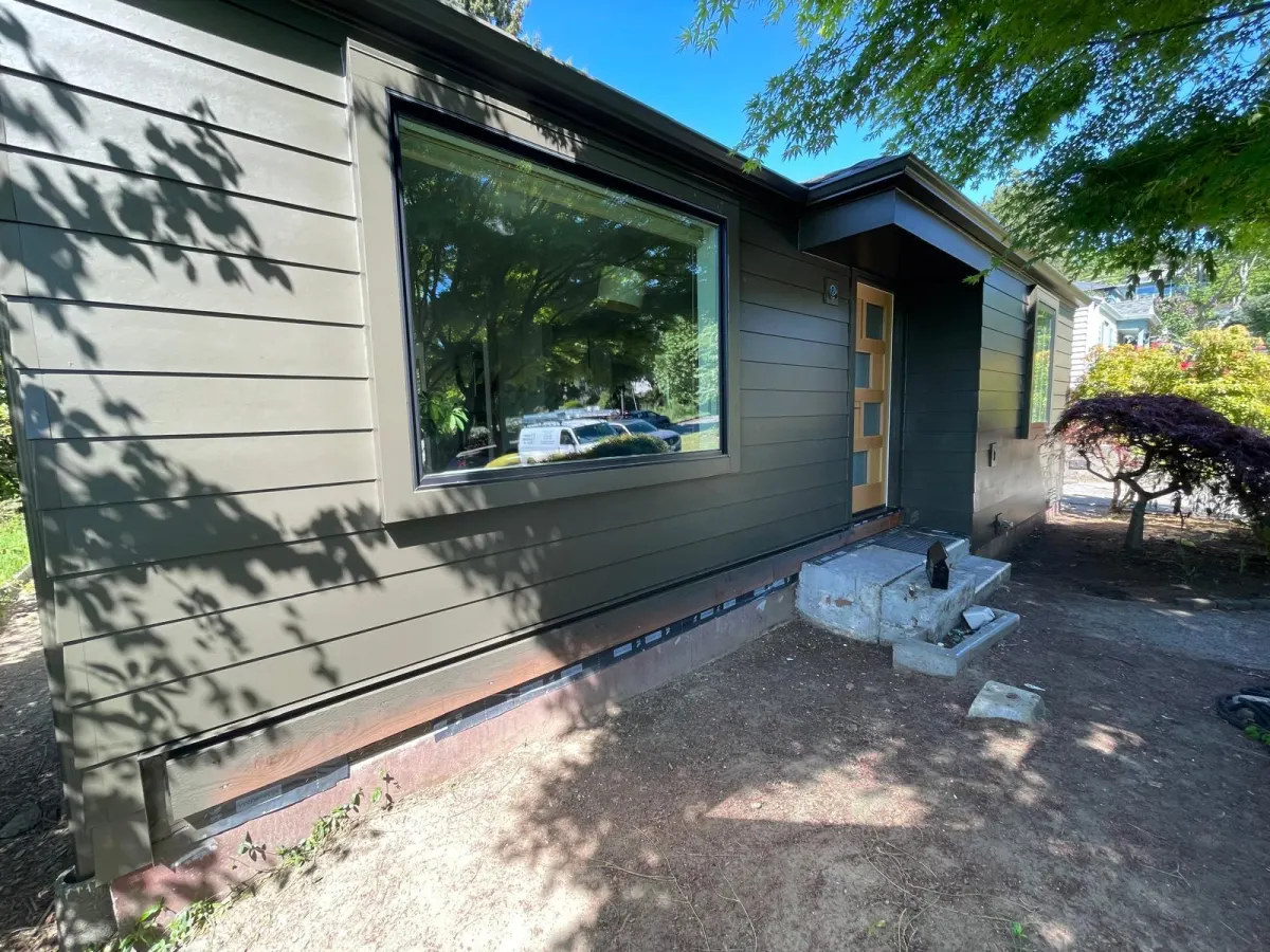 After: repainted siding, trim, and front entry